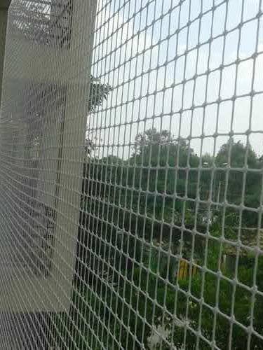 Balcony bird net looking out over greenery