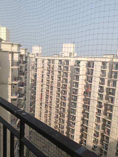 Bird net installed on an apartment society balcony railing