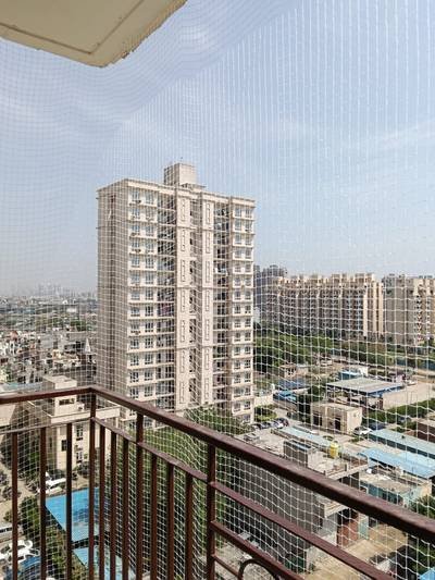 Balcony safety net on an apartment with a wide city view