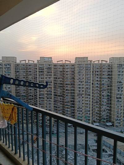 Balcony safety net on a high-rise apartment at dusk