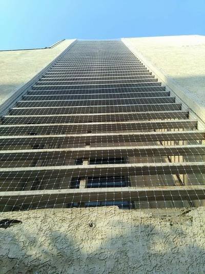 Pigeon protection net running the full height of a residential tower